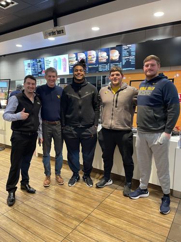 West Virginia University football players receive NIL contracts with McDonald's